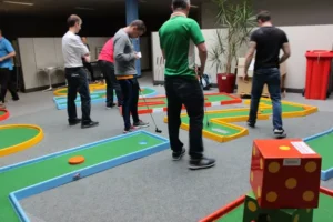 Indoor mini golf at a Hiya family fun day | Event management company